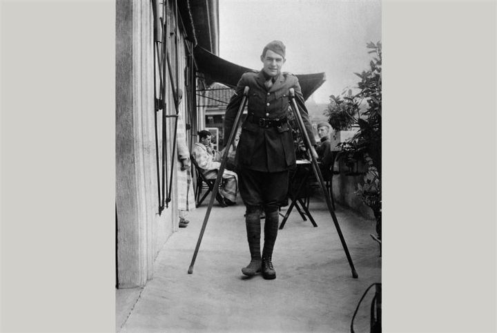 Ernest Hemingway on crutches while recovering in Milan, Italy, 1918